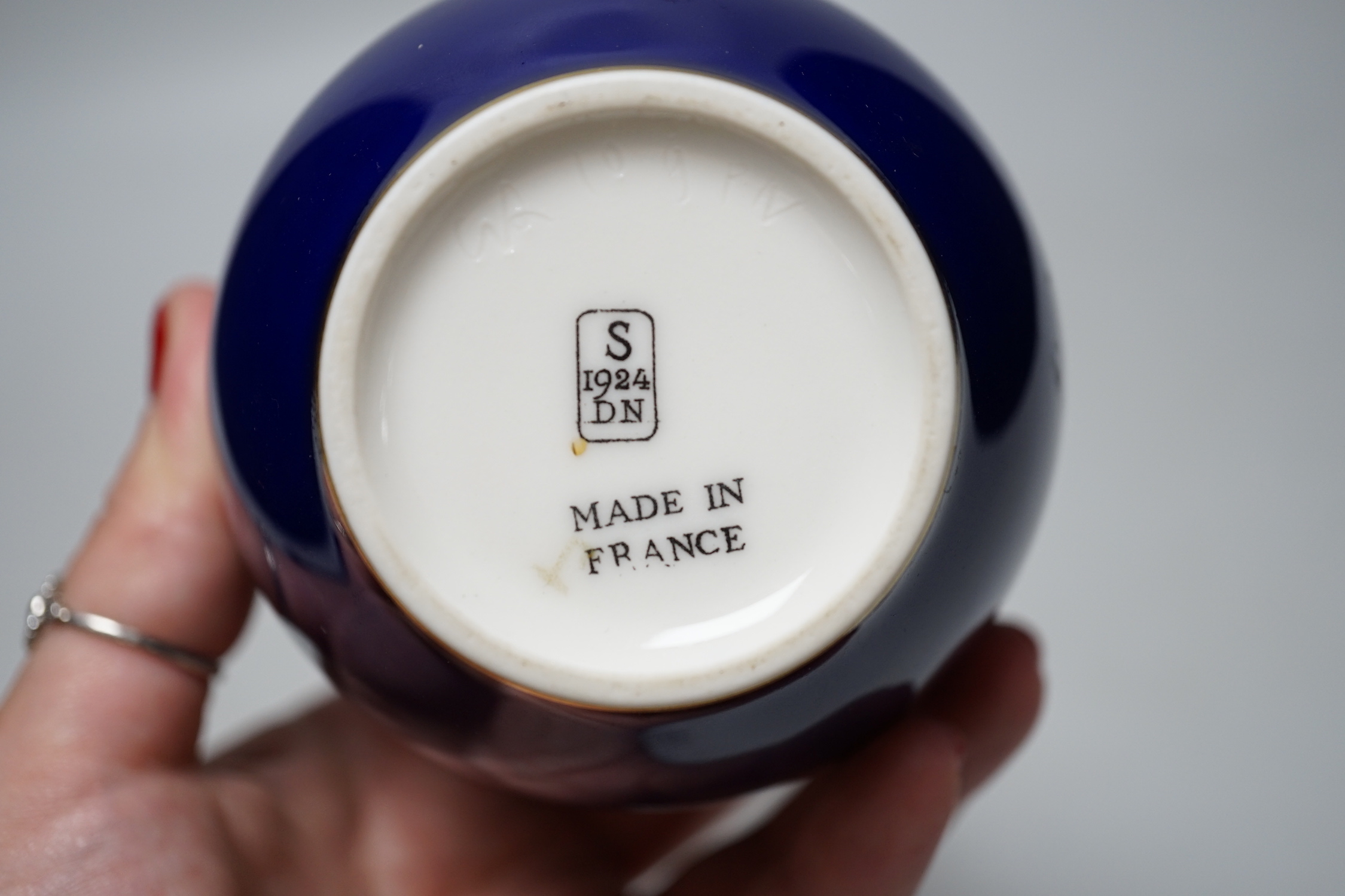 A Sevres blue glazed bottle vase, date code for 1924, 17cm